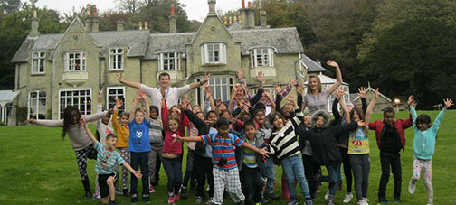Smiling school children at their IW school trip overnight accommodation